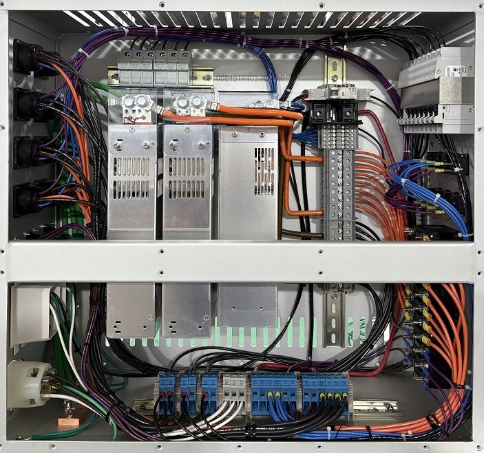 Open electro mechanical enclosure with labeled wiring, inspected for quality