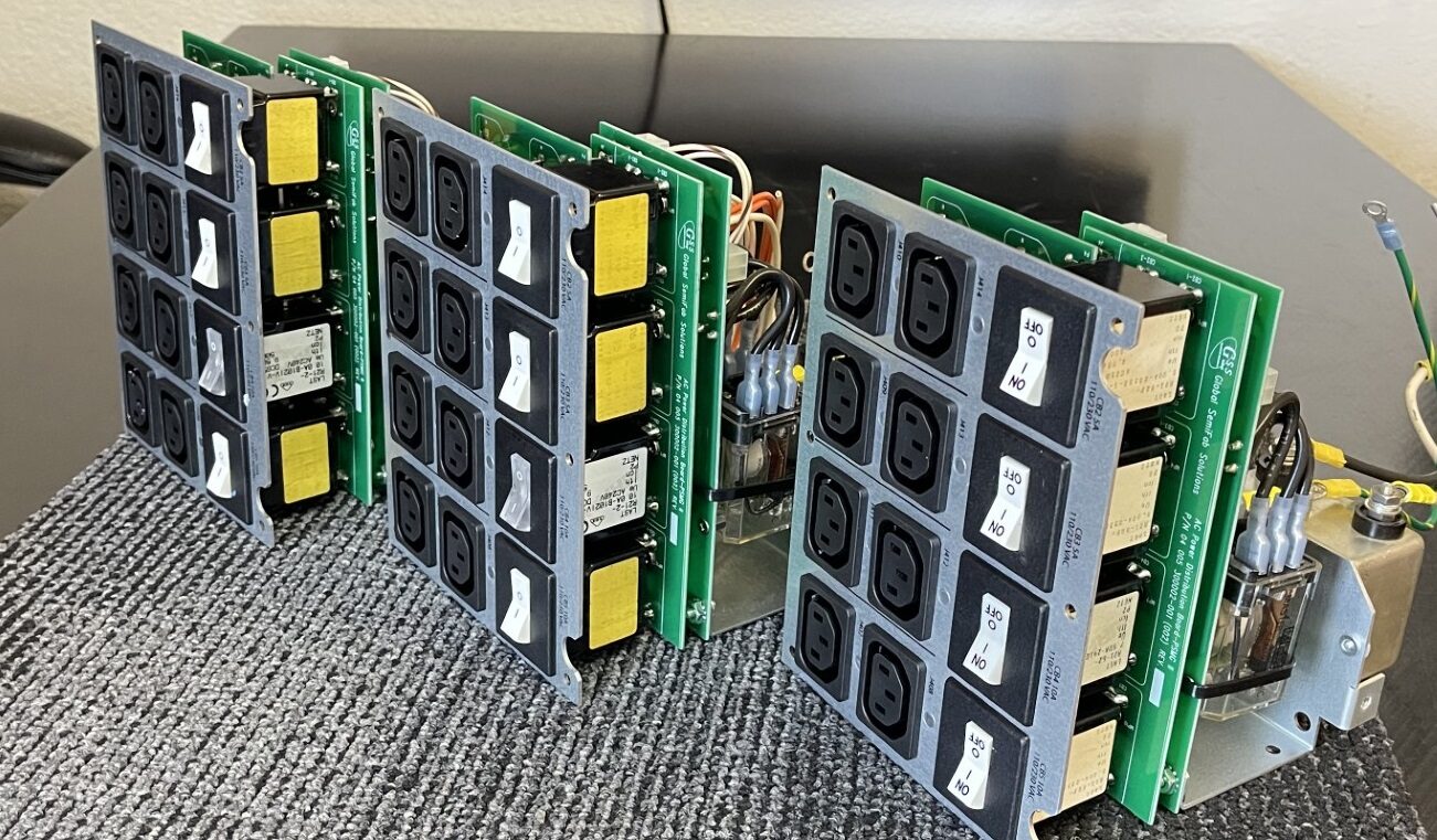 Green PCB power distribution boards undergoing final inspection