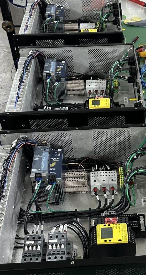 Finished electro mechanical enclosure with connector panel and power supplies, built by HPN Electronics