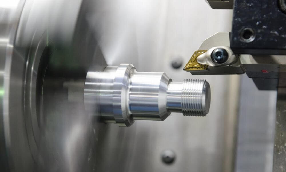 CNC lathe machining a precision aluminum part